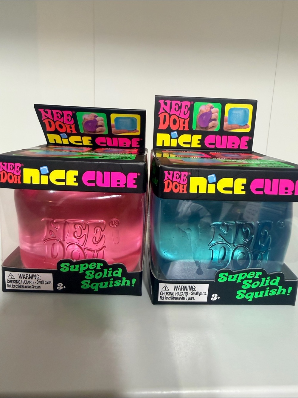 New in Box - 2 pack NeeDoh Nice Cube Squish Toy - Pink & Blue